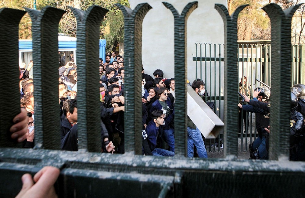 Iranian students clash with riot police during an anti-government protest around the University of Tehran, Iran, 30 December 2017. (EPA Photo)