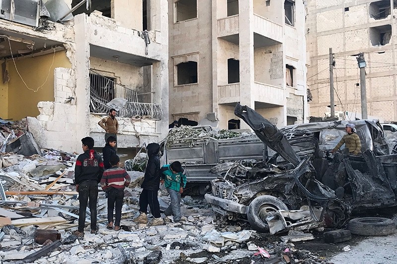 People look at the damage in the aftermath of an explosion in an opposition-held area of the northwestern Syrian city of Idlib on Jan. 8, 2018. (AFP Photo)