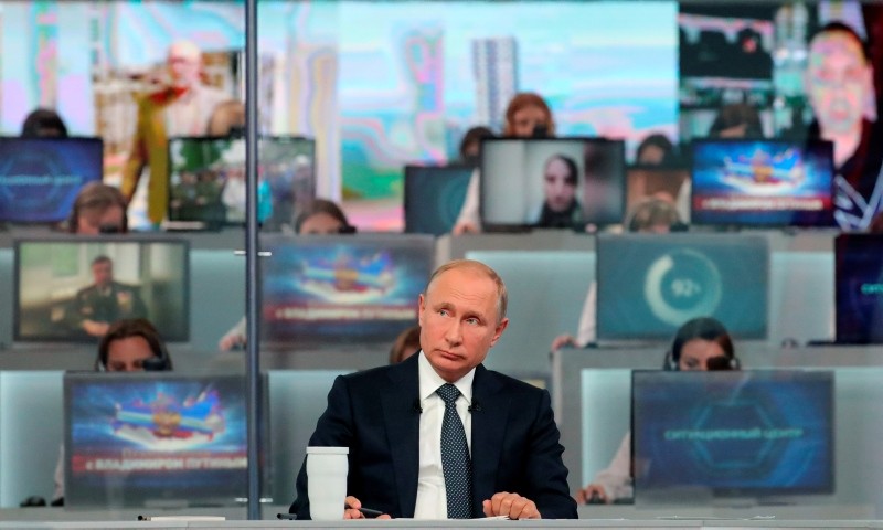 Russian President Vladimir Putin listens to a question during his annual call-in show in Moscow, Russia, Thursday, June 7, 2018. (AP Photo)