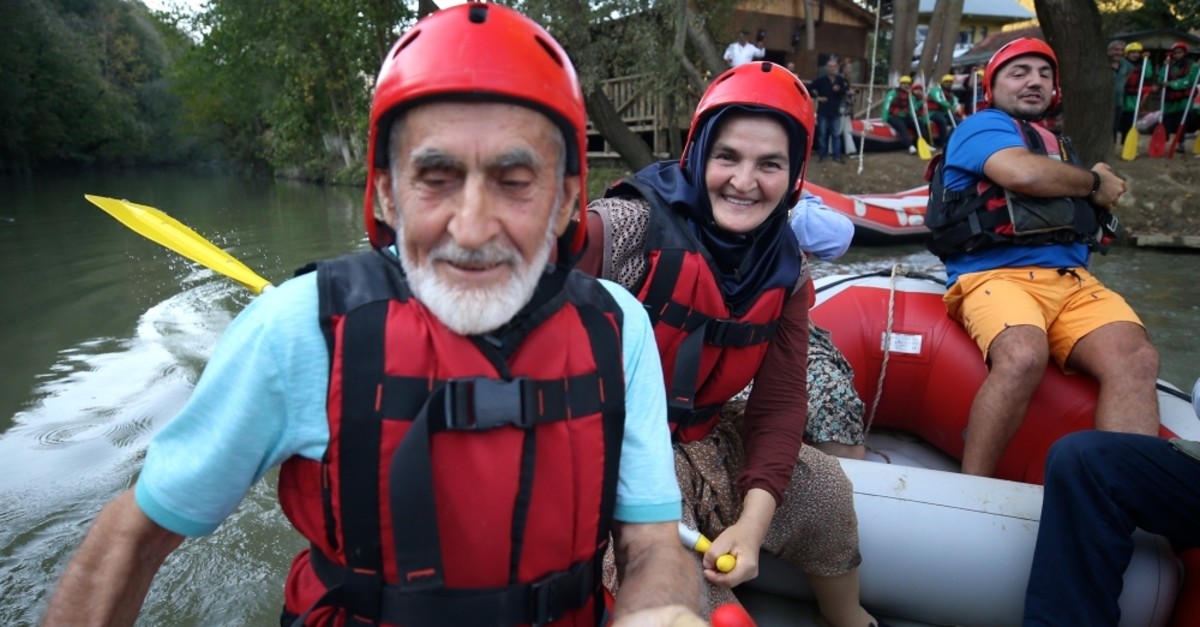 Senior citizens enjoy dancing with the waves while rafting in Du00fczce, Turkey.