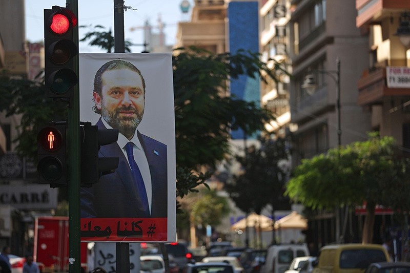 A poster for Lebanese Prime Minister Saad Hariri is seen hanging on a traffic signal in Beirut's Hamra street on November 15, 2017 (AFP Photo)