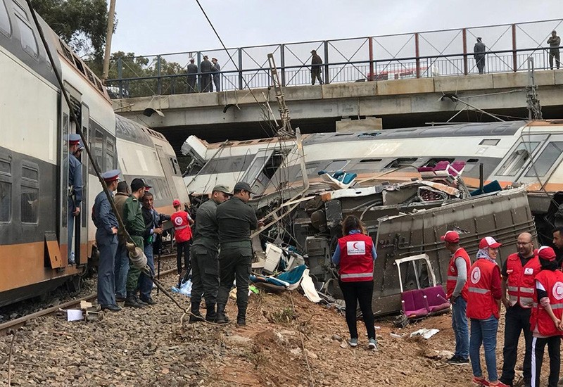 Aid workers gather at the site of train derailment at Sidi Bouknadel near the Moroccan capital Rabat, Morocco, Oct. 16, 2018. (Reuters Photo)