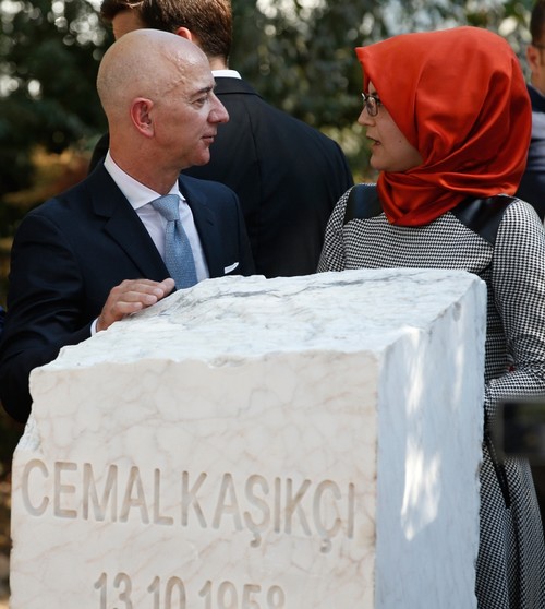 Bezos and Cengiz talk after unveiling the plaque in Istanbul, Oct. 2, 2019. (AP Photo)