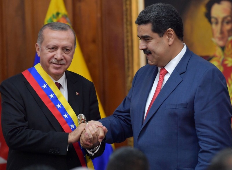 Venezuelan President Nicolas Maduro (R) and Turkish President Recep Tayyip Erdogan are pictured at Miraflores Presidential Palace in Caracas, on December 3, 2018. (AFP Photo)