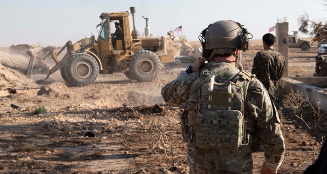 This file photo dated Aug. 23, 2019 and provided by the US Central Command Twitter account (@CENTCOM) shows military fortifications of the SDF being removed.
