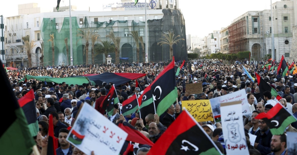 Protesters march during a demonstration to stand against Gen. Khalifa Haftar's armed offensive in Tripoli, at Martyrs Square in central Tripoli, Libya, April 12, 2019. 
