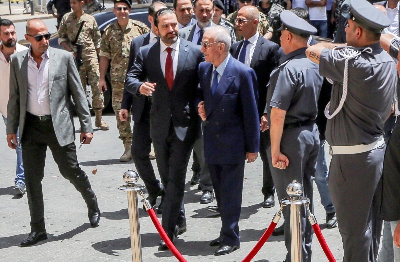  Lebanese Prime Minister Saad Hariri (C-L) with Lebanese member of the parliament Michel El-Murr (C-R) arrive to attend the first session in the parliament in downtown Beirut, Lebanon, 23 May 2018. (EPA Photo)