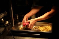 A chef prepares vegan food in the Green Grill section of the Green Vic, which is aiming to be the world's most ethical pub, in Shoreditch, London, Britain July 5, 2019. (Reuters Photo)