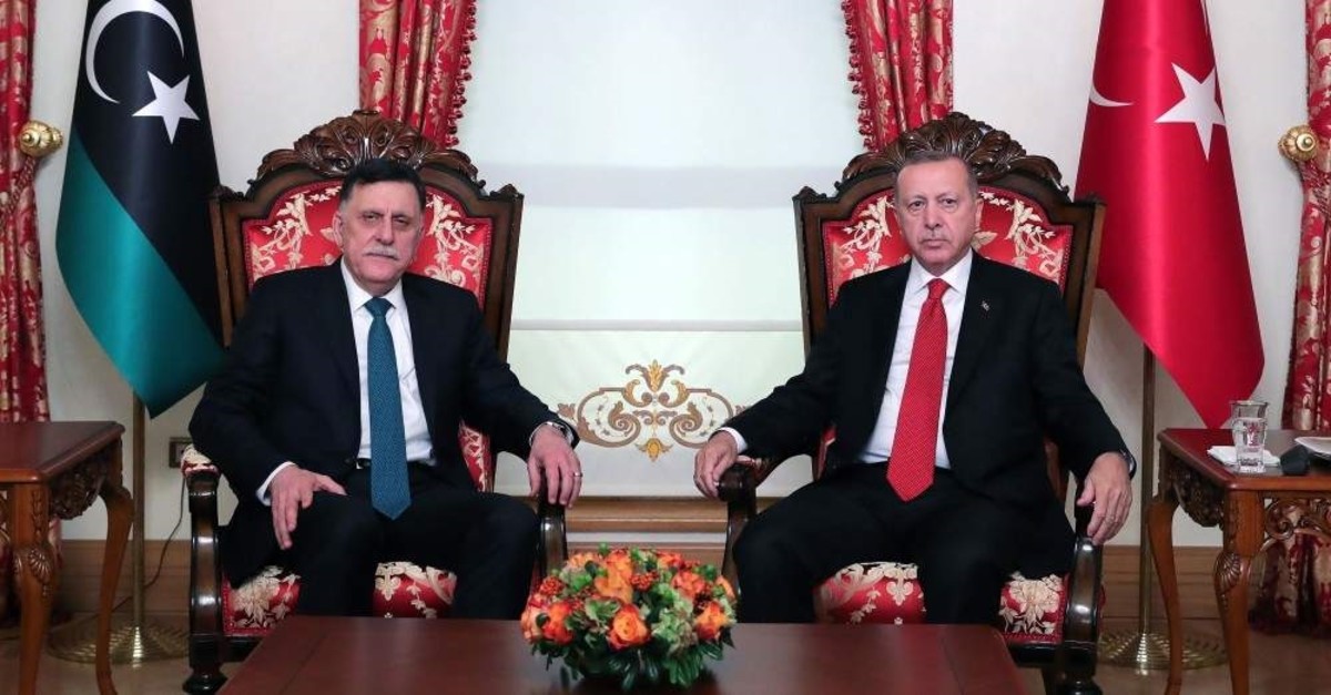 President Recep Tayyip Erdo?an (R) and Fayez al-Sarraj (L), the head of the Tripoli-based Government of National Accord (GNA), pose during their meeting in Istanbul, Nov. 27, 2019. (AFP)