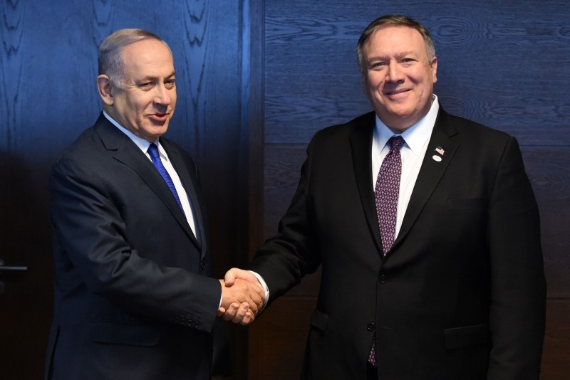 Israeli PM Benjamin Netanyahu (L) shake hands with U.S. Secretary of State Mike Pompeo as they talk to the press on the sidelines of a session at the conference on Peace and Security in the Middle east in Warsaw, on Feb. 14, 2019. (AFP Photo)