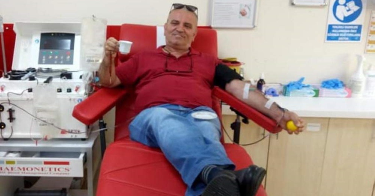 Emin u015eahin sips a cup of coffee after donating blood, ?zmir, Oct. 24, 2019. (DHA Photo) 