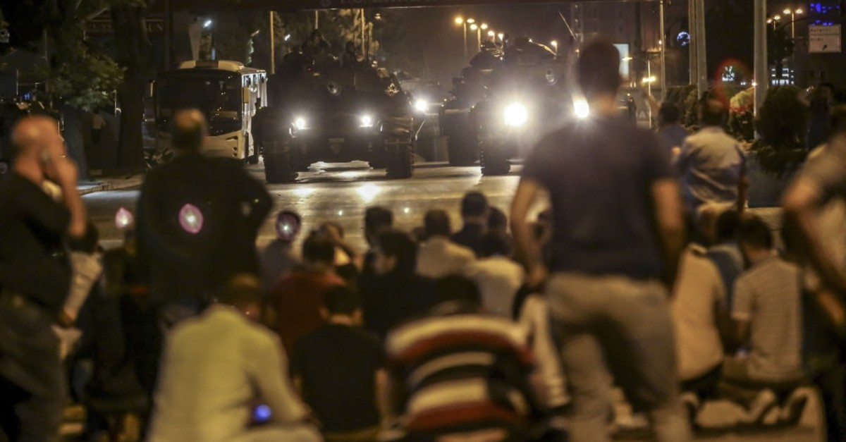 People confront tanks controlled by putschists in Ankara, July 15, 2016.