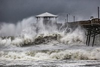 Waves slam the Oceana Pier & Pier House Restaurant in Atlantic Beach, N.C., Thursday, Sept. 13, 2018, as Hurricane Florence approaches the area. (AP Photo)