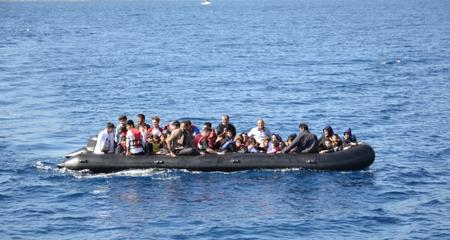 A group of illegal Afghan migrants aboard a boat off the coast of Ayvacık in western Turkey, Oct. 15, 2019. (DHA Photo)