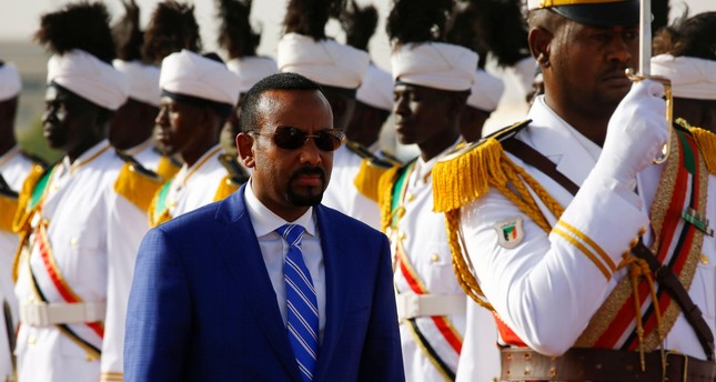 Ethiopian Prime Minister Abiy Ahmed reviews the honour guard following his arrival in Khartoum for an official visit to Sudan on May 2, 2018.