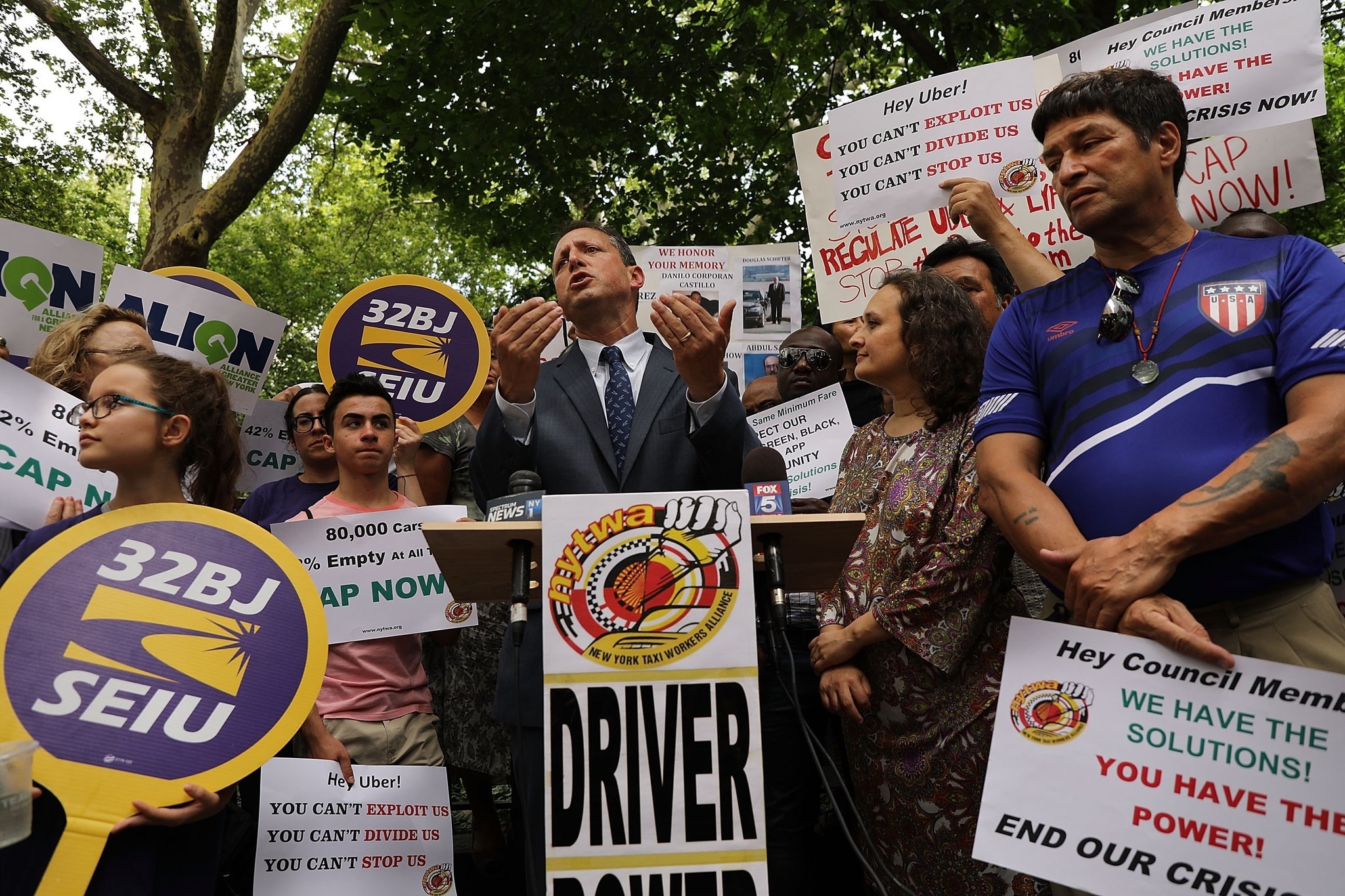 Councilman Brad Lander speaks at a rally in front of City Hall in support of a proposed city council vote on a 12-month cap of For Hire Vehicles in Manhattan on July 31.
