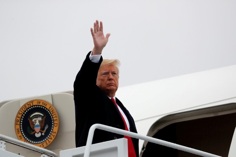 U.S. President Donald Trump waves while boarding Air Force One prior to departing Washington on a campaign trip at Joint Base Andrews in Maryland, U.S., November 5, 2018. (REUTERS Photo)
