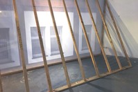 u00d6u011fu00fct created a scale sculpture of the building and constructed wood stands behind it to display the names of NSU victims written in gold. 