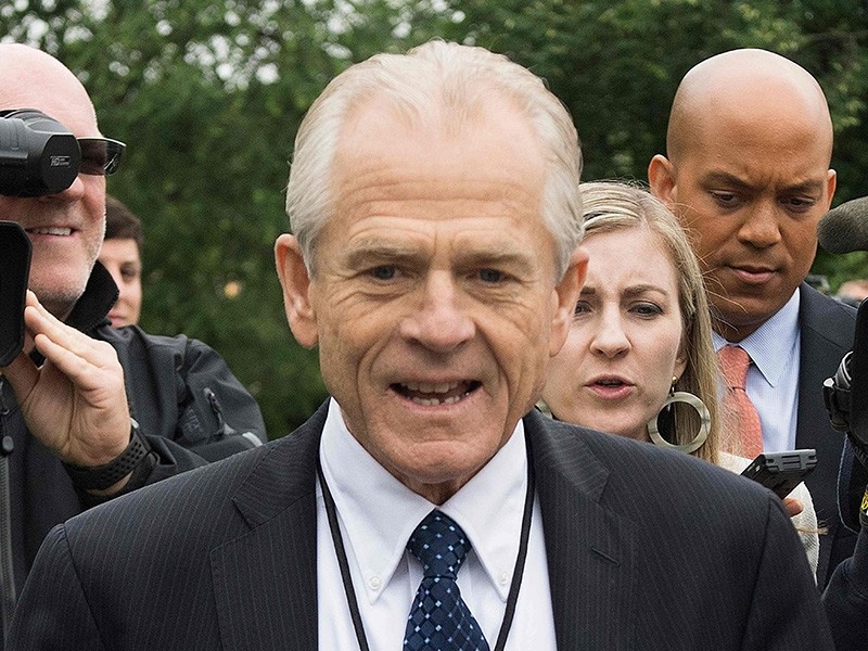 White House Director of Trade Policy Peter Navarro dodges the press after speaking on Fox News at the White House in Washington, DC, on June 4, 2018. (AFP Photo)