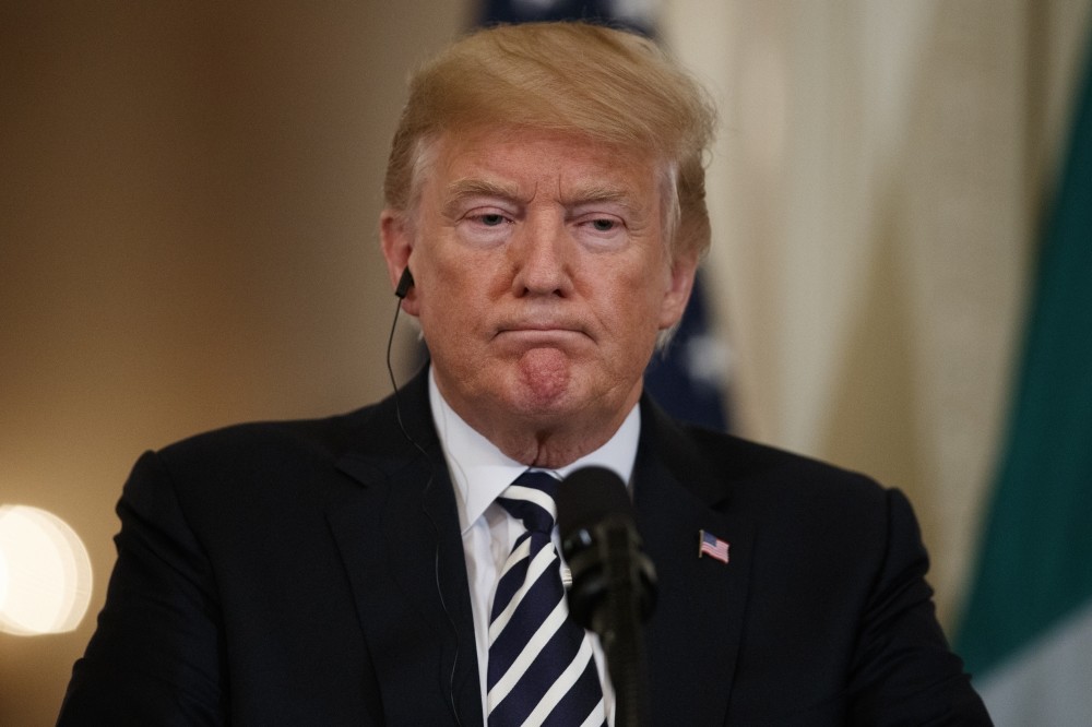 U.S. President Donald Trump listens to Italian Prime Minister Giuseppe Conte during a news conference, Washington, D.C., July 30.