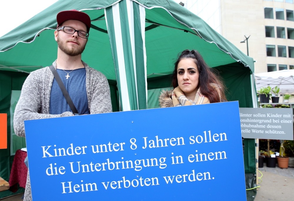 Patrick (L) and Ayu015fe (R) Dahlhoff joined the demonstration in Brussels against Germany. (AA Phoyo)