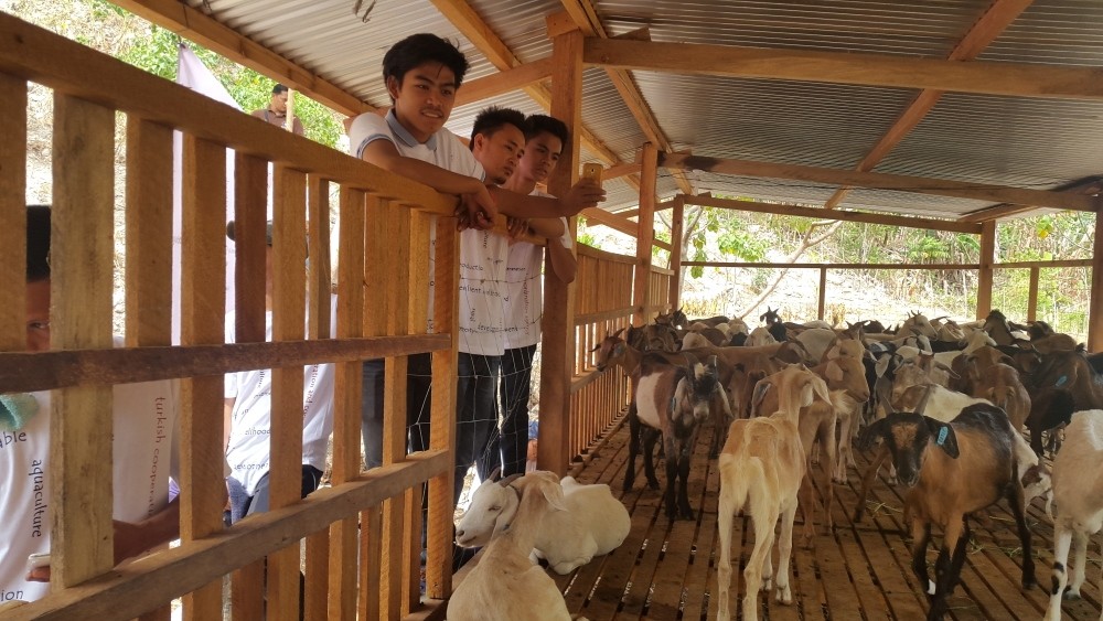 Locals at a pen for goats provided by Tu0130KA in Mindanao. The agency also aims to boost agricultural income in the island.