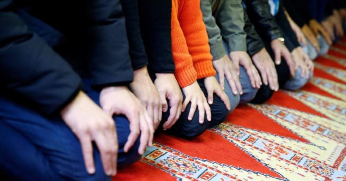 Muslims pray during Friday prayers at a Turkish mosque in Cologne. (Reuters Photo)