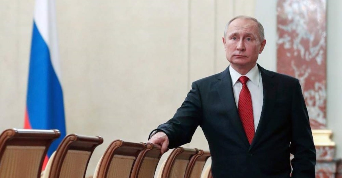 Russian President Vladimir Putin stands prior to a Cabinet meeting, Moscow, Jan. 15, 2020. (AP Photo)