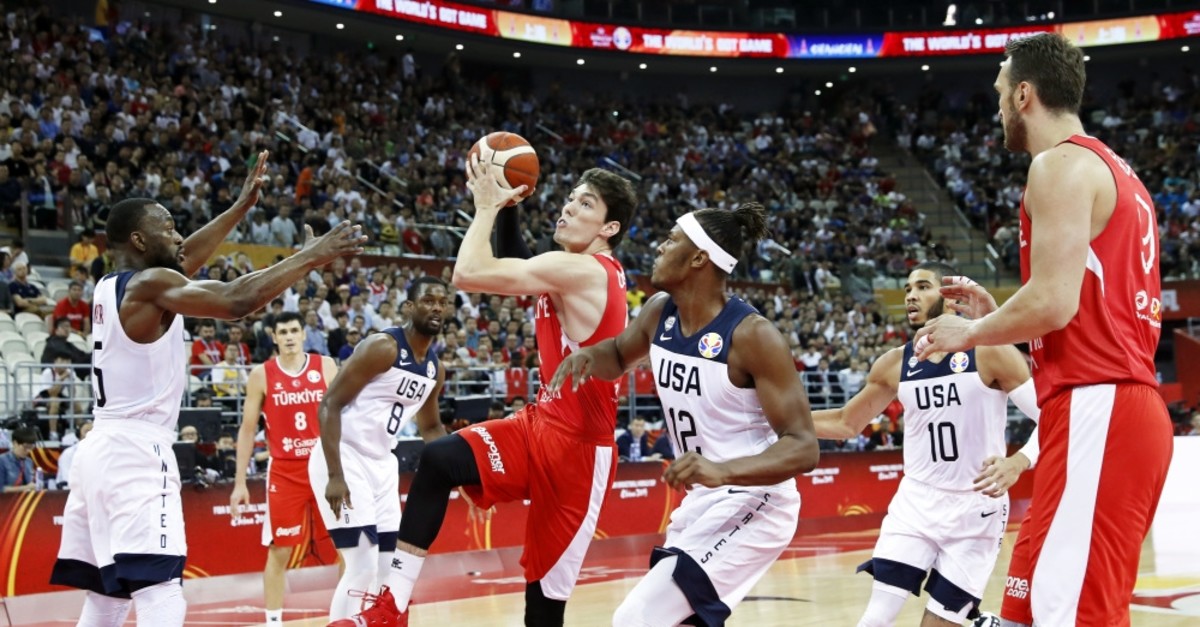 Myles Turner (C-R) of the USA in action against Cedi Osman (C-L) of Turkey during the U.S.-Turkey game in Shanghai, Sept. 3 2019.