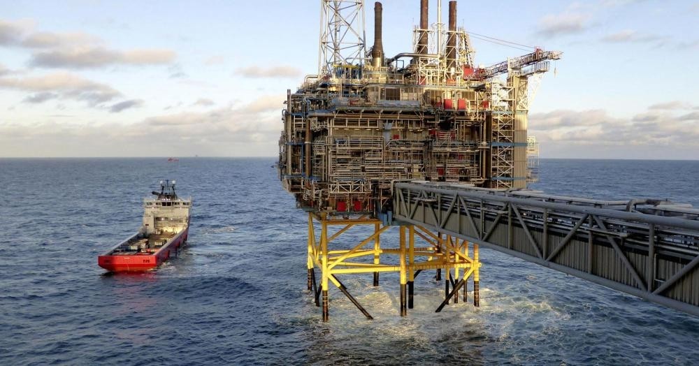 Norway's wealth fund, which reached $1 trillion in size, divests from energy firms which violate its ethical principles for environment, human rights and governance.