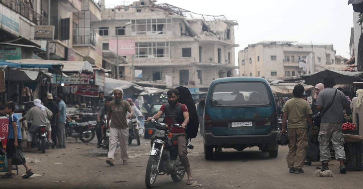 A man rides on a motorbike through a crowded souk in the city of Idlib, Syria, May 24, 2019.