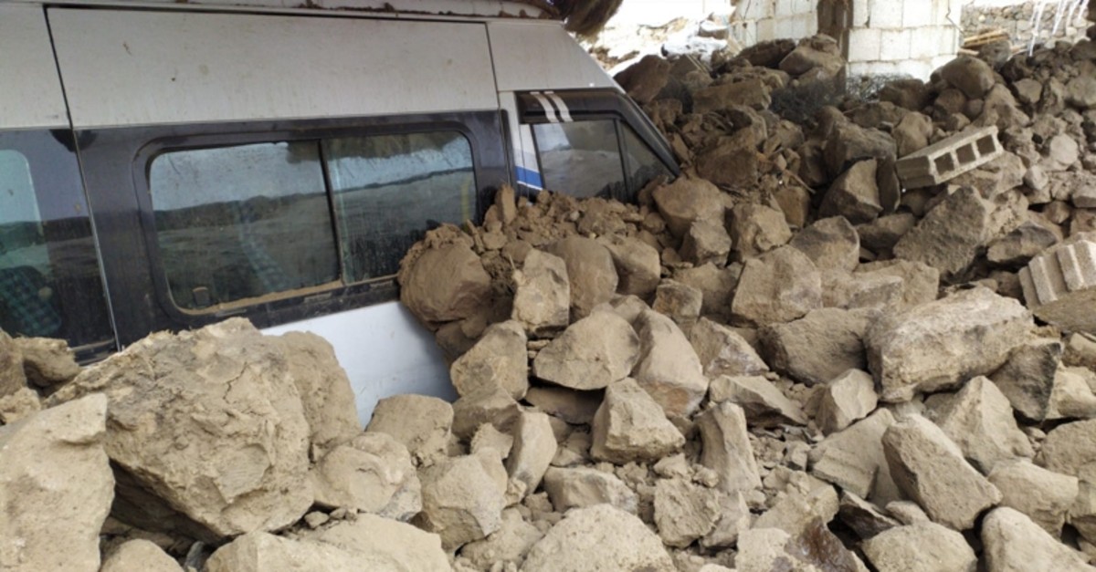 Vehicle buried under debris after magnitude 5.7 earthquake in Turkey's eastern Van province on Sunday, Feb. 23, 2020 (AA Photo)