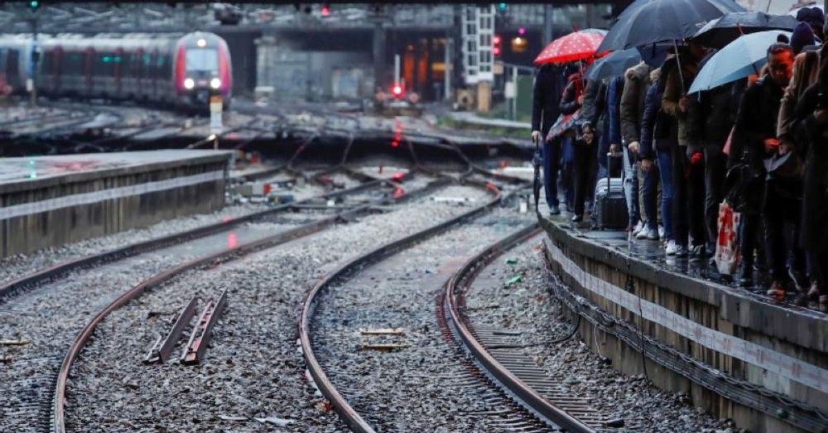 Commuters walk on a platform at Gare Saint-Lazare train station as a strike continues against French government's pensions reform plans, in Paris, France, December 9, 2019. (Reuters Photo)
