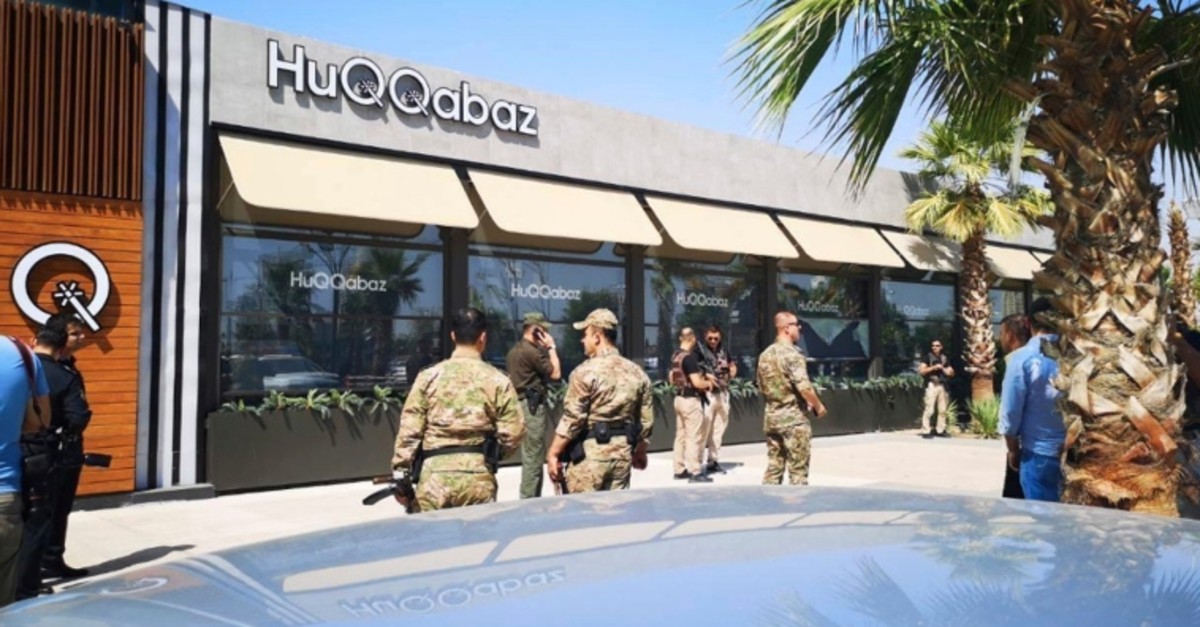 Security forces gather at the scene of a shooting outside a restaurant in Irbil, Iraq, Wednesday, July 17, 2019. (AP Photo)