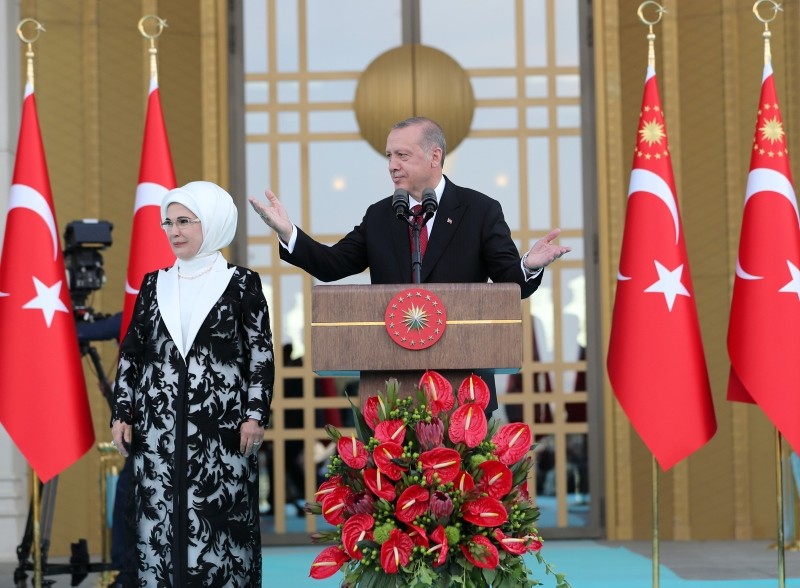 President Recep Tayyip Erdoğan, accompanied by his wife Emine Erdoğan, makes a speech during a ceremony at the Presidential Complex in Ankara, Turkey July 9, 2018.