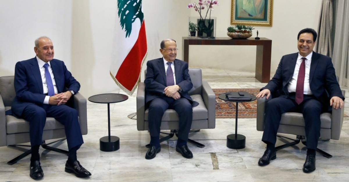 Lebanese President Michel Aoun, center, meets with Prime Minister-designate Hassan Diab, right, and Parliament Speaker Nabih Berri, left, at the Presidential Palace in Baabda, east of Beirut, Lebanon, Tuesday, Jan. 21, 2020. (AP Photo/Bilal Hussein)