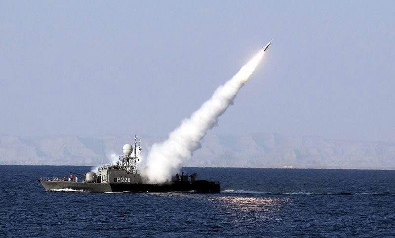 An Iranian navy warship test fires a new long range missile (Mehrab) during the Iranian navy military exercise on the Sea of Oman, near the Strait of Hormuz. (EPA File Photo)