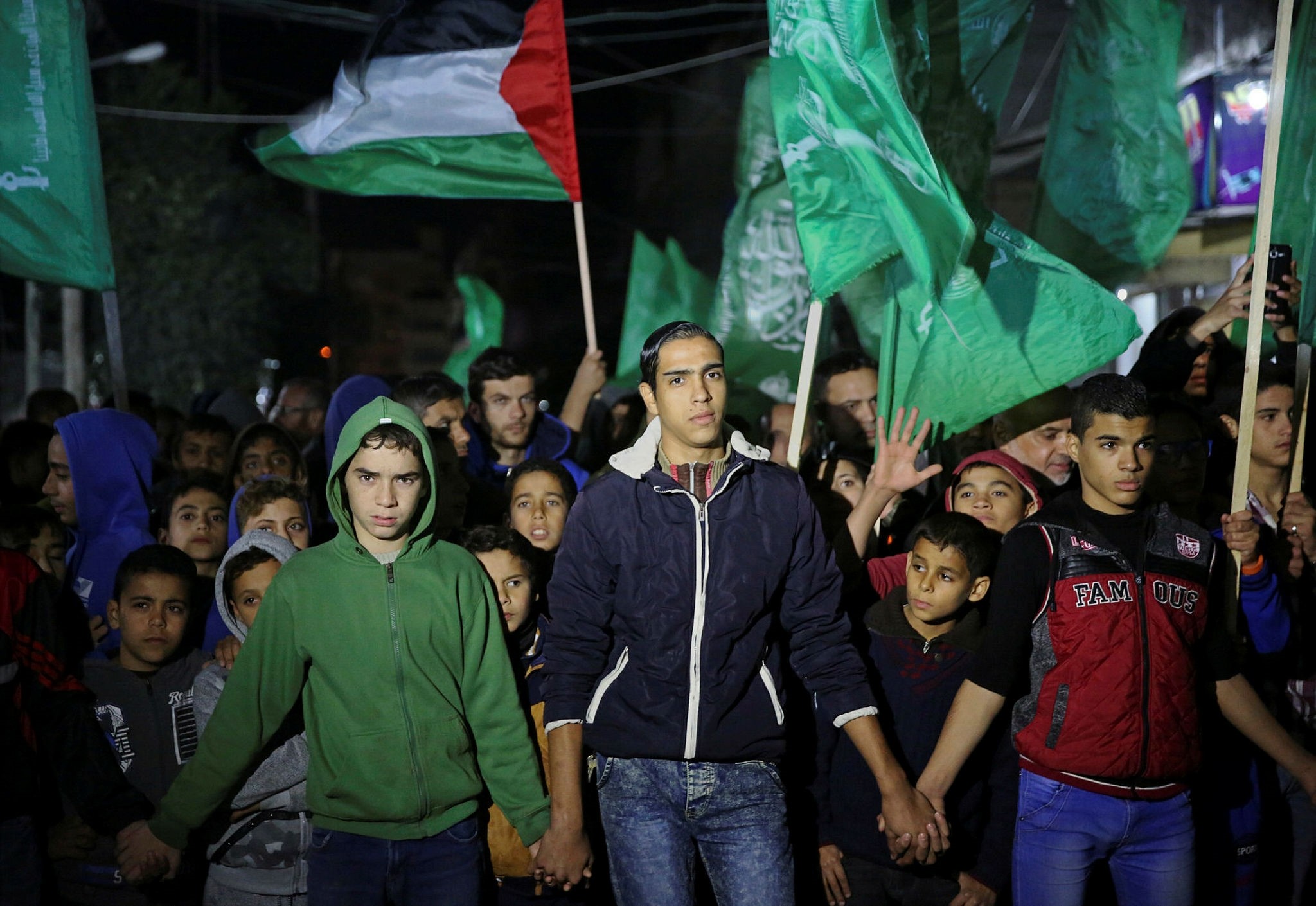 Supporters of Palestinian resistance group Hamas wave their green flags during a protest against the possible U.S. decision to recognize Jerusalem as Israel's capital, in Jebaliya Refugee Camp, Gaza Strip, Wednesday, Dec. 6, 2017. (AP Photo)
