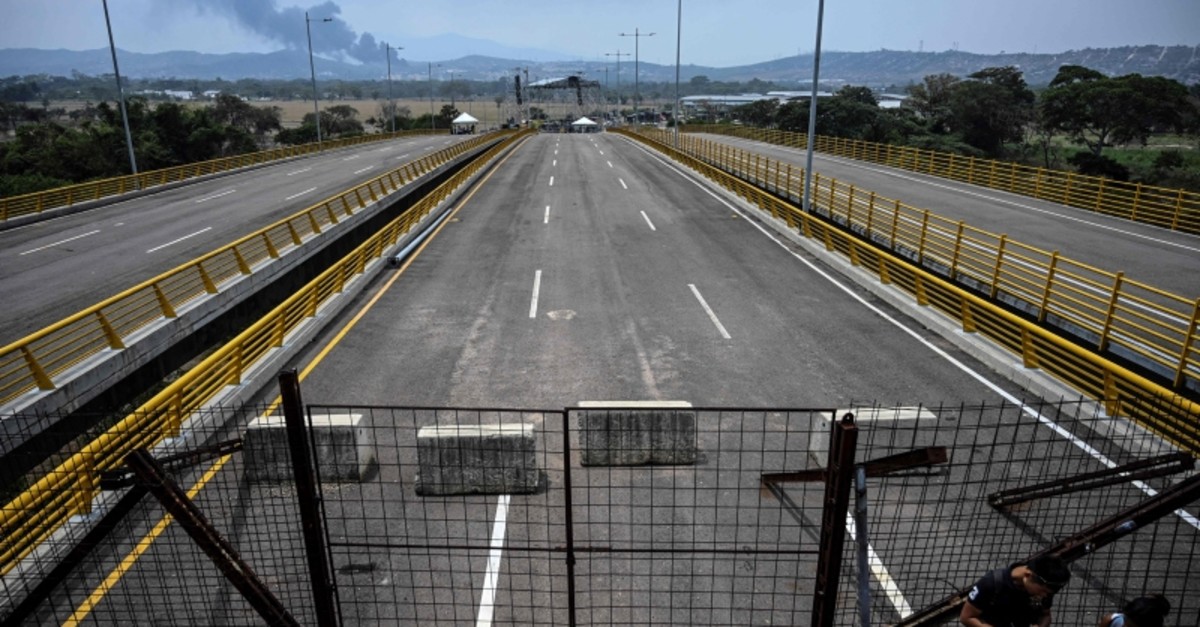 Containers block the Tienditas bridge, with a stage in the background -where a concert will take place on Saturday 23- in Urena, Venezuela, on the border with Colombia, on February 20, 2019. (Reuters Photo)