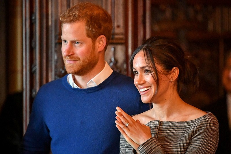 Britain's Prince Harry and his fiancee Meghan Markle watch a performance by a Welsh choir in the banqueting hall during a visit to Cardiff Castle in Cardiff, Britain, January 18, 2018. (Reuters Photo)