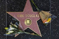 Flowers are placed on actor Kirk Douglas' start on the Hollywood Walk of Fame in Los Angeles, Wednesday, Feb. 5, 2020. (AP Photo)