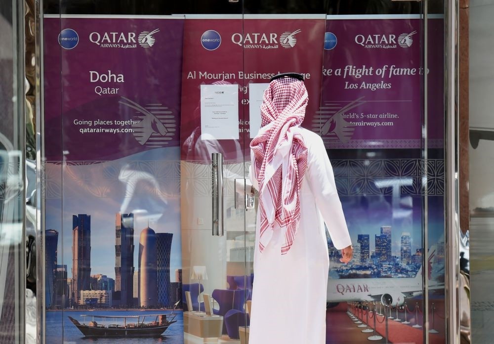 A man standing outside the Qatar Airways branch in the Saudi capital Riyadh after it had suspended all flights to Saudi Arabia following a severing of relations between major Gulf states and Qatar, June 5.