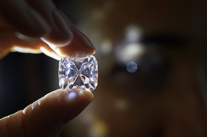 In this Nov. 8, 2017 file photo a Christie's employee displays ,Le Grand Mazarin,, a legendary 19.07-carat pink diamond during a preview at Christie's, in Geneva, Switzerland (AP Photo)