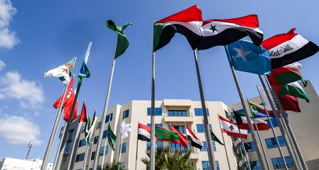 This picture taken on March 28, 2019 shows the flags of the Arab League member states flying outside the Council of Arab Interior Ministers' headquarters in the Tunisian capital Tunis, ahead of the summit due to take place on March 31. (AFP Photo)