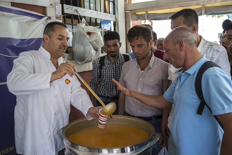 Gökrem offering free soup and other food to homeless. (AA Photo)