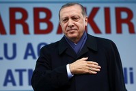 President Tayyip Erdou011fan greets his supporters during a rally for the referendum in the Kurdish-dominated southeastern city of Diyarbaku0131r, April 1.