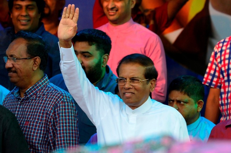 This Nov. 5, 2018 photograph show Sri Lanka's President Maithripala Sirisena waving to supporters at a rally in Colombo, Sri Lanka. (AFP Photo)
