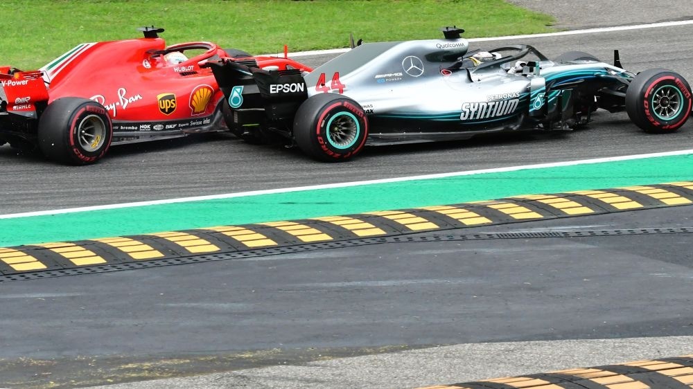 Mercedesu2019 British driver Lewis Hamilton (front) and Ferrariu2019s German driver Sebastian Vettel crash during the Italian Formula One Grand Prix at the Autodromo Nazionale circuit in Monza, Sept. 2.