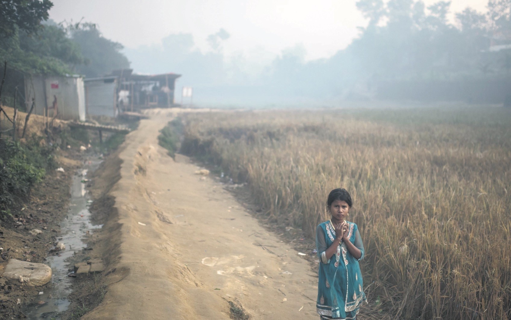 A Rohingya migrant child walks through the Balukhali refugee camp in Cox's Bazar, Bangladesh, Nov. 28.