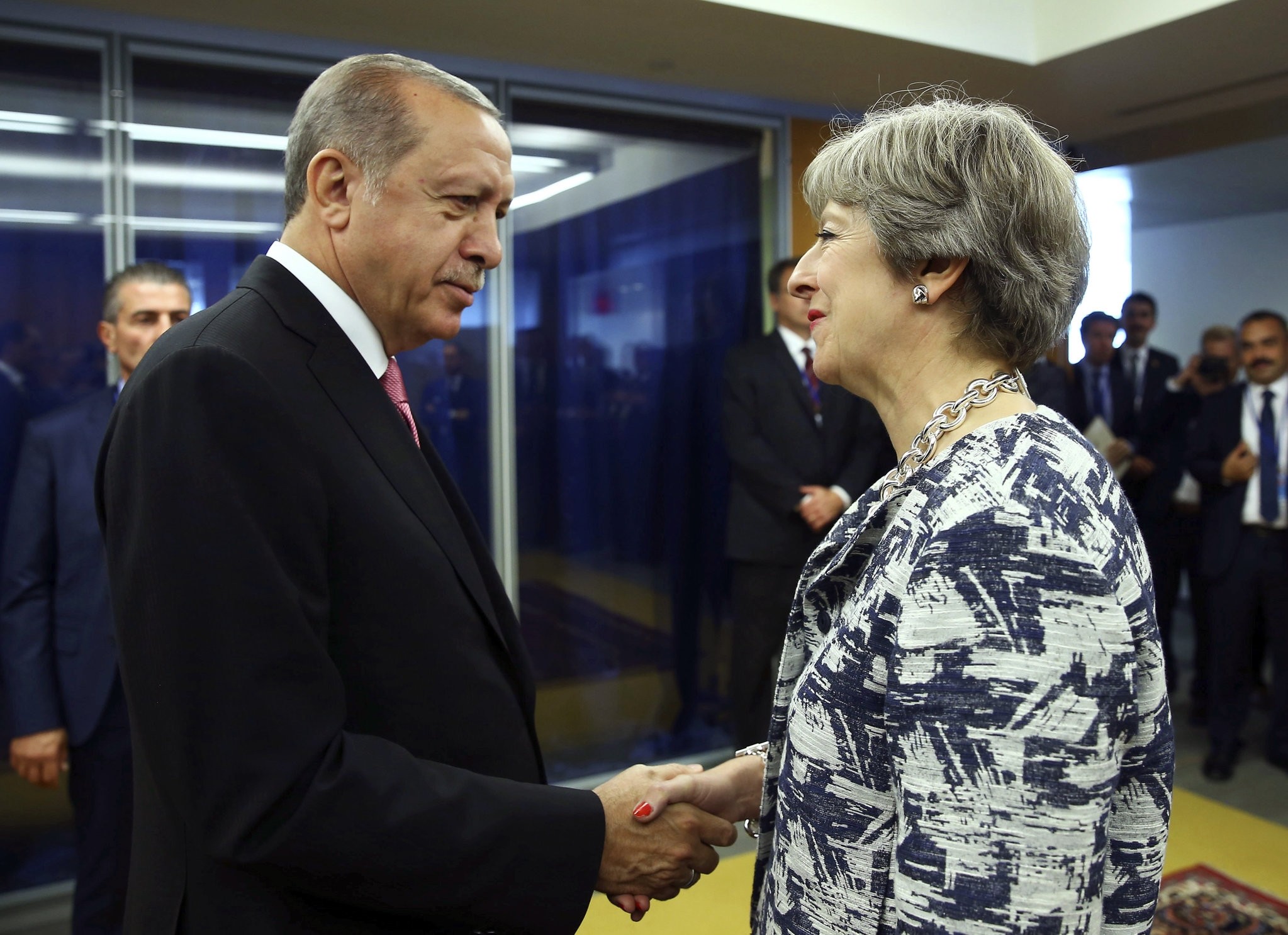 President Recep Tayyip Erdogan (L) shakes hands with British Prime Minister Theresa May at U.N. headquarters, New York City, Sept. 19. 
